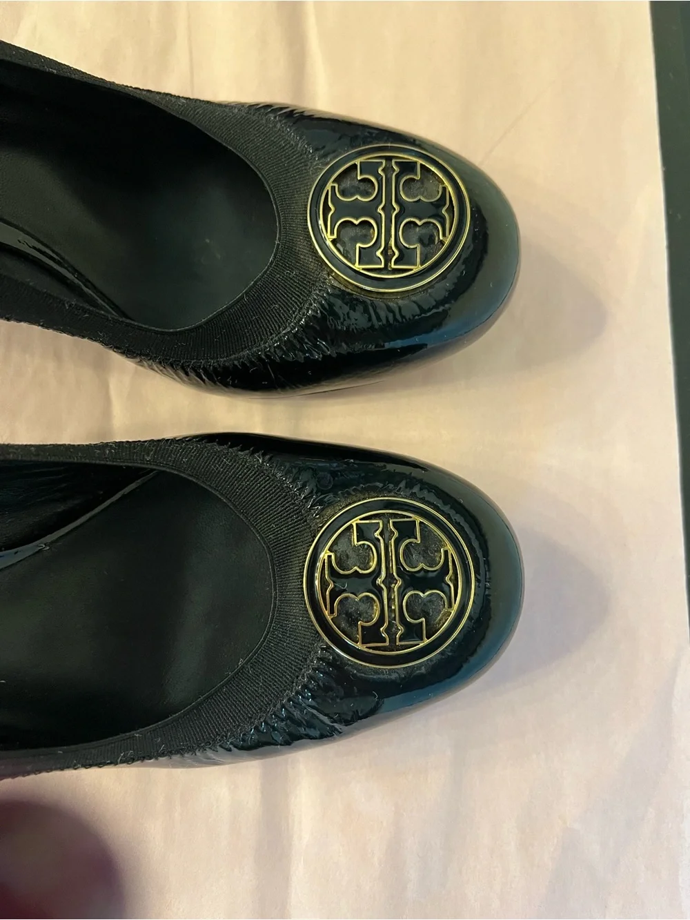 Tory Burch Black Patent Logo Round-Toe Pumps with Gold Emblem